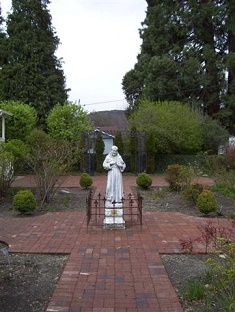 Statue of St. Francis of Assisi in the Old Rose Garden in Jacksonville, OR